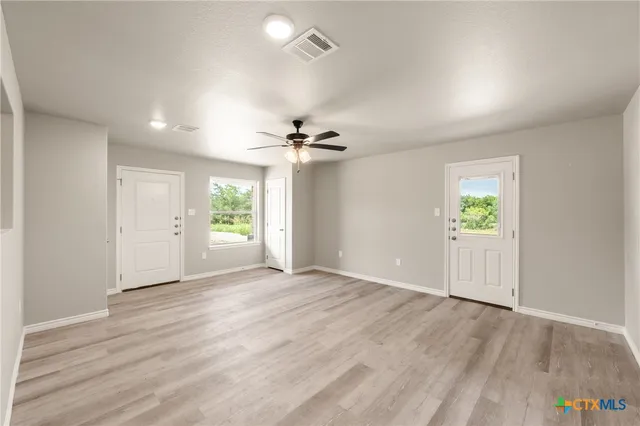 a view of an empty room with a window