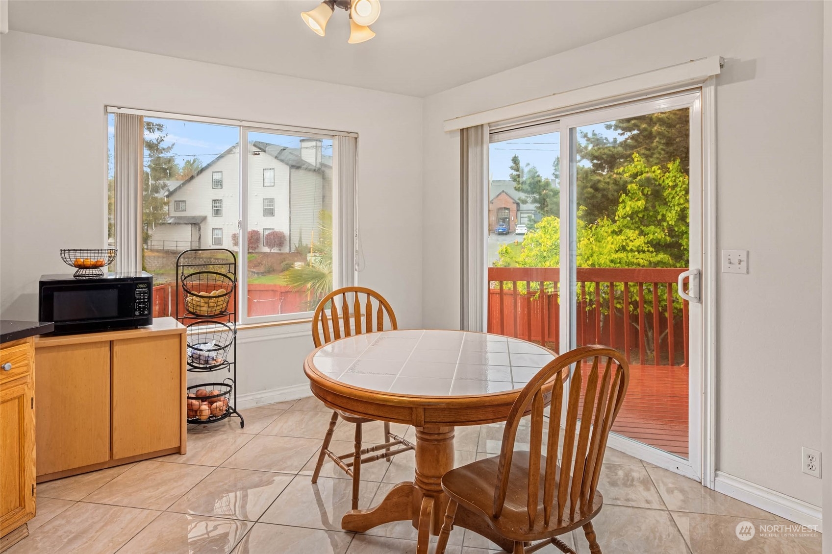 9031 West Mall Drive Everett, WA 98208 - Photo 14 of 32 a view of a dining room with furniture a chandelier and wooden floor