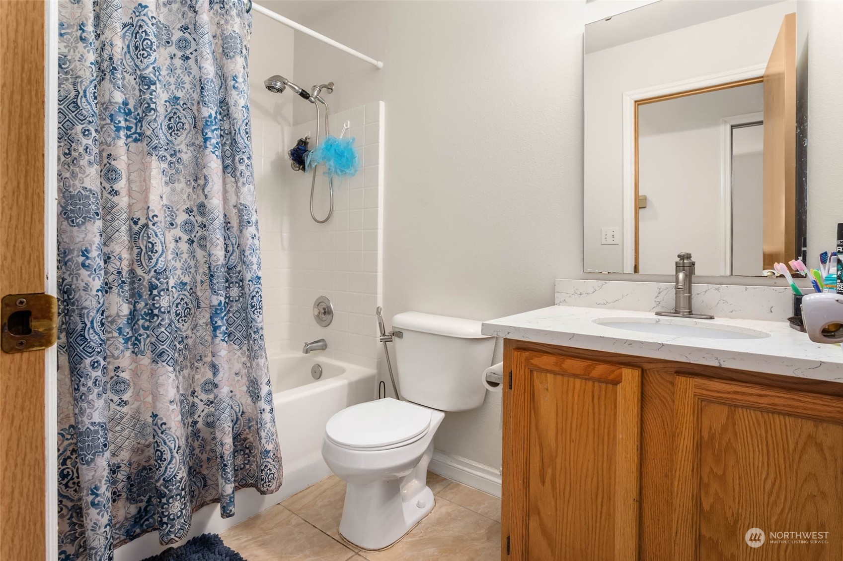 9031 West Mall Drive Everett, WA 98208 - Photo 16 of 32 a bathroom with a sink toilet and shower