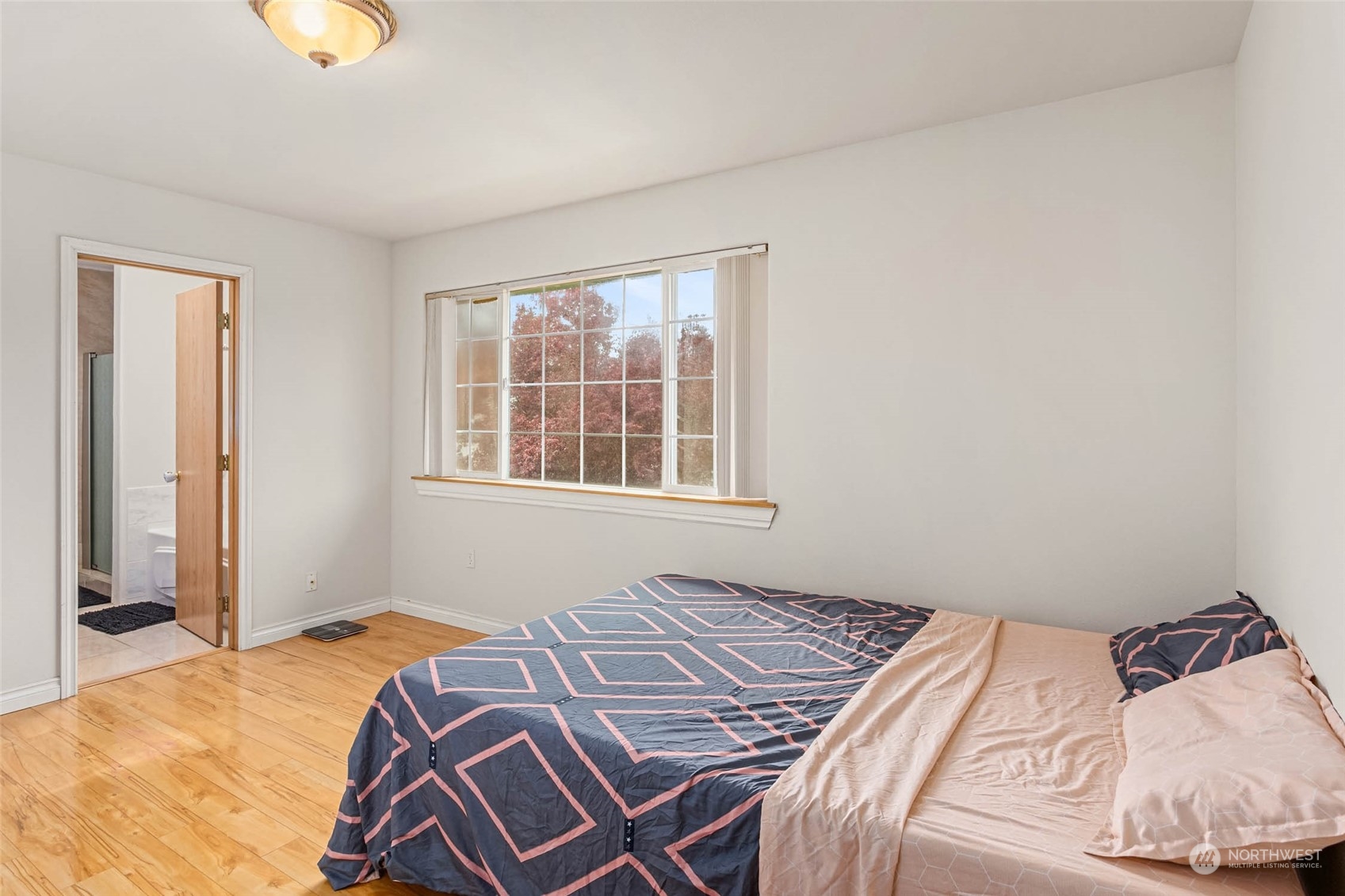 9031 West Mall Drive Everett, WA 98208 - Photo 21 of 32 a bedroom with a bed and a window
