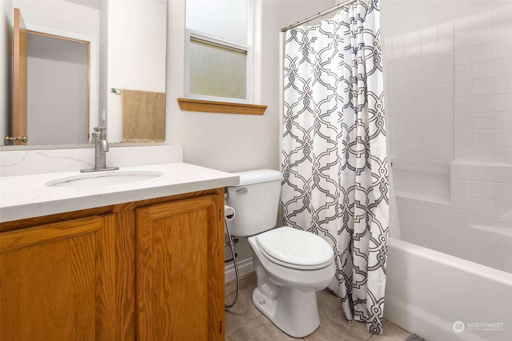 9031 West Mall Drive Everett, WA 98208 - Photo 24 of 32 a bathroom with a sink toilet and shower