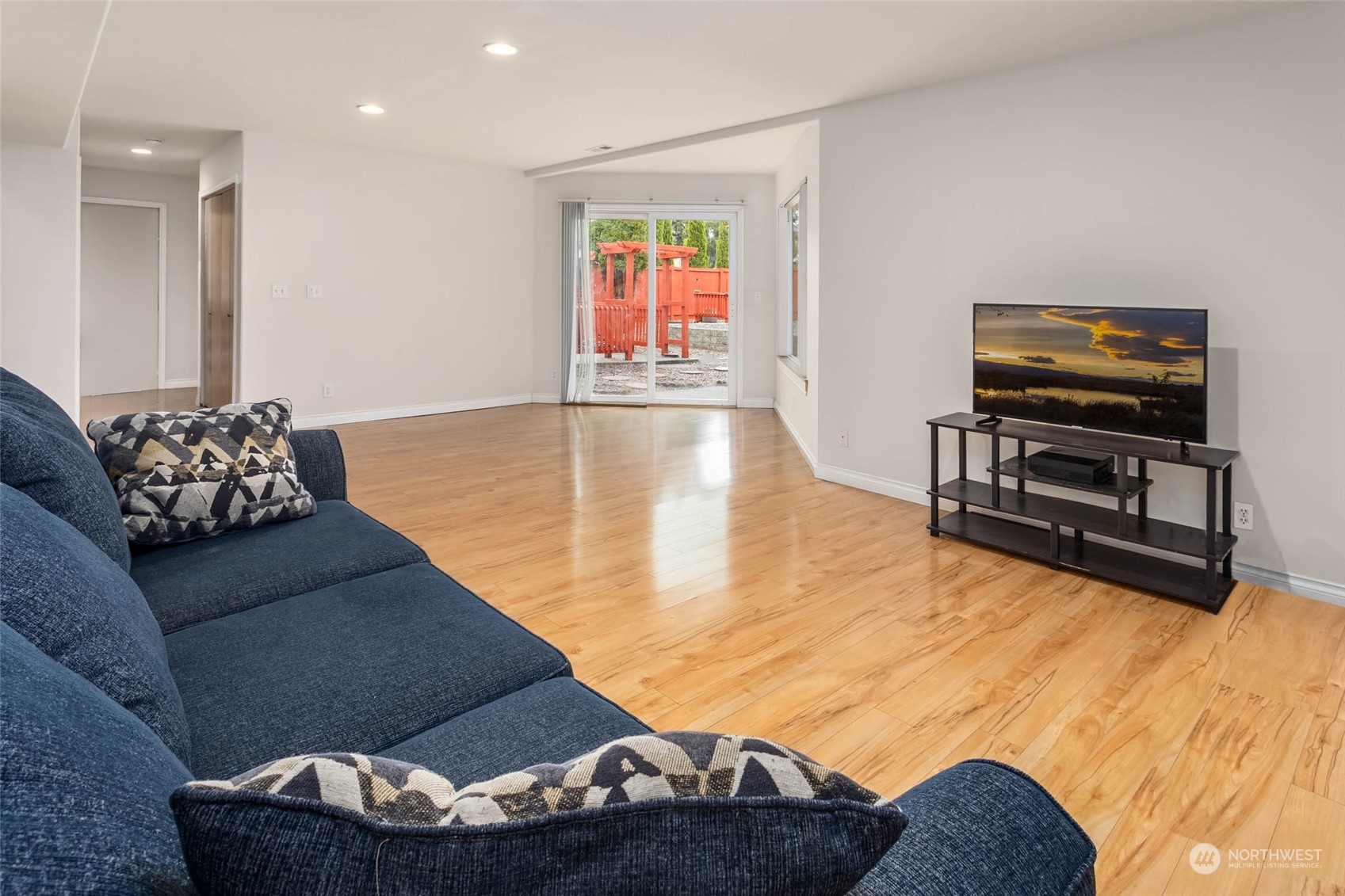 9031 West Mall Drive Everett, WA 98208 - Photo 26 of 32 a living room with furniture and a flat screen tv