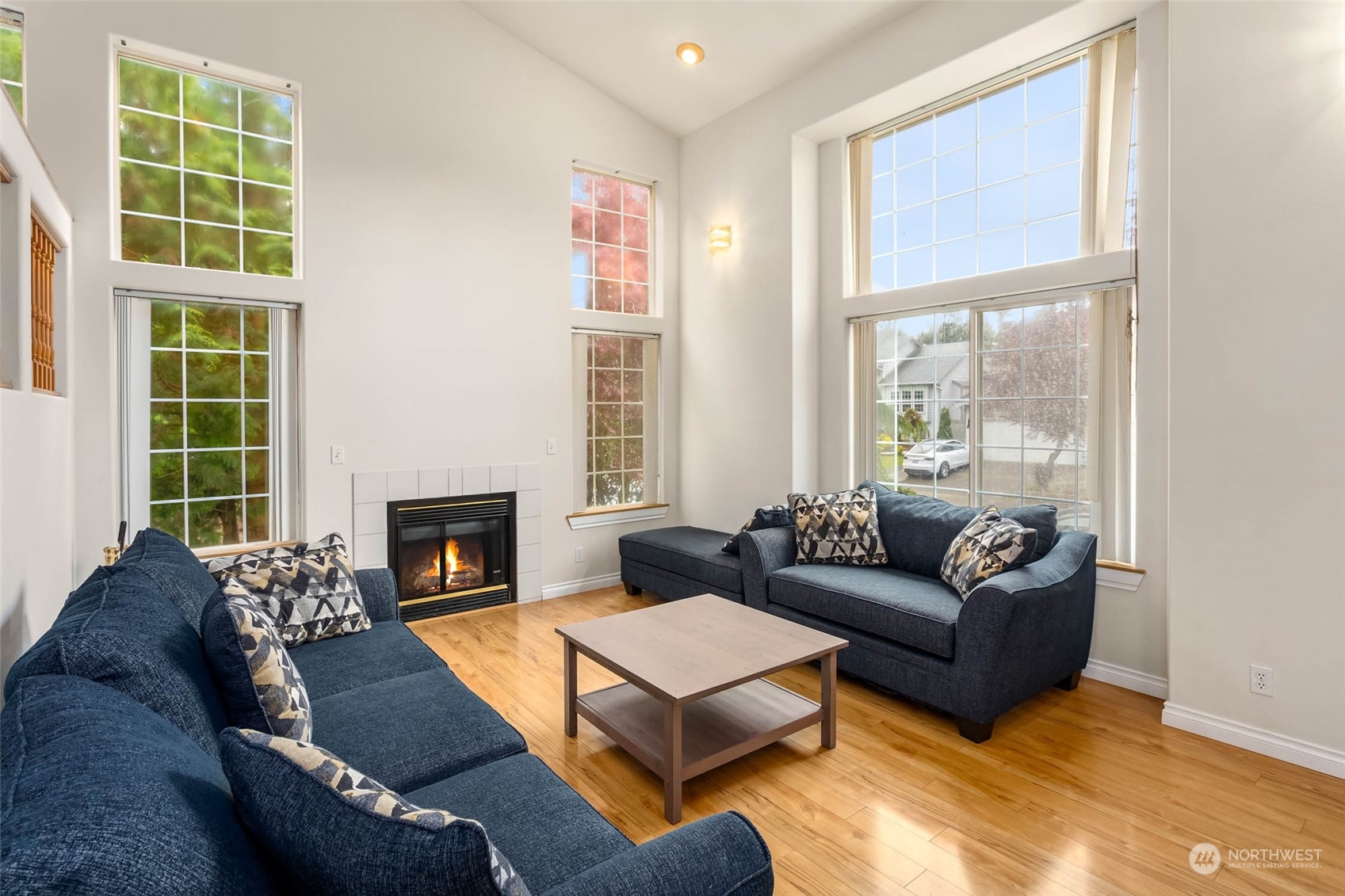 9031 West Mall Drive Everett, WA 98208 - Photo 5 of 32 a living room with furniture and a fireplace