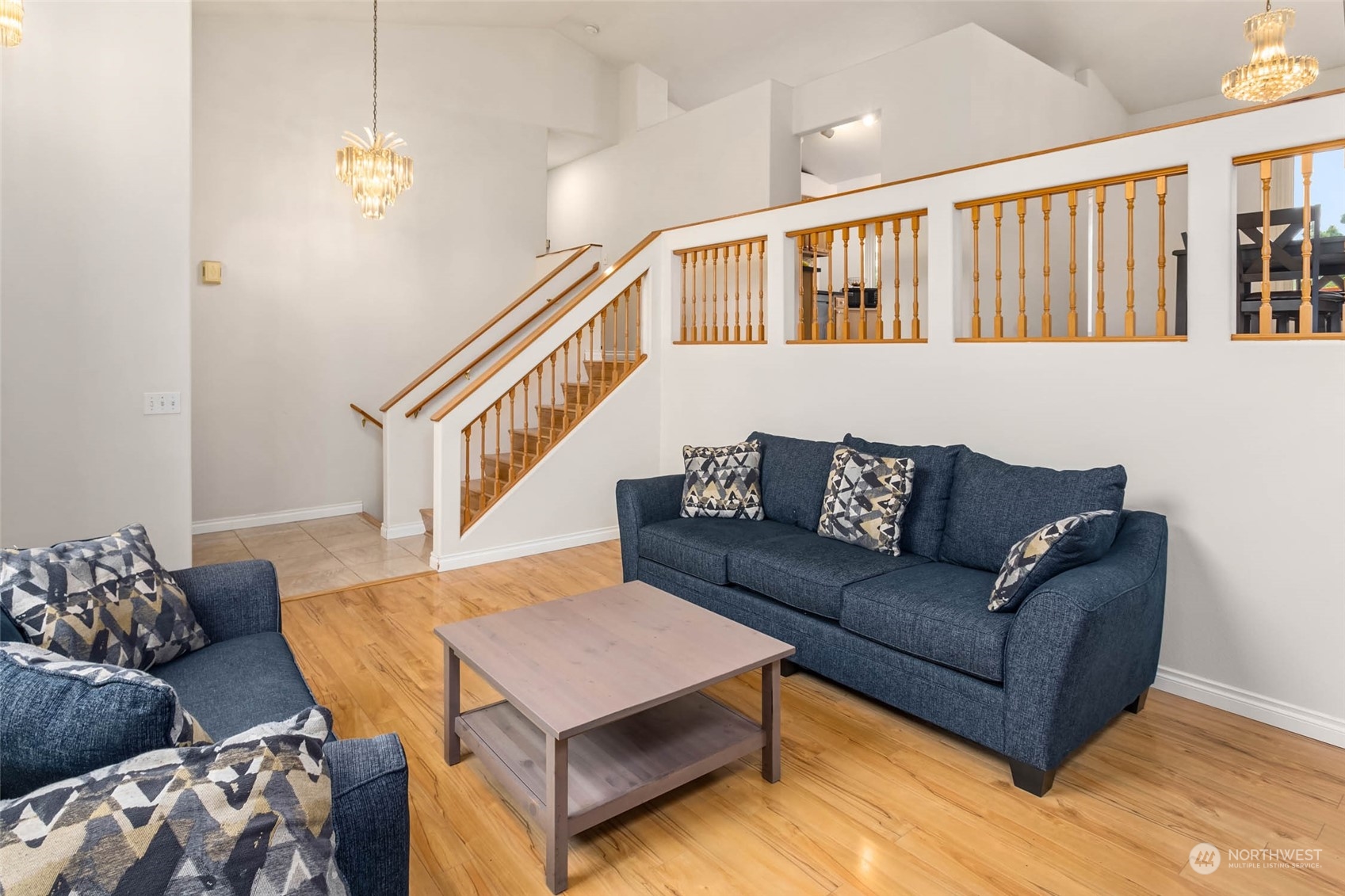 9031 West Mall Drive Everett, WA 98208 - Photo 6 of 32 a living room with furniture and a book shelf
