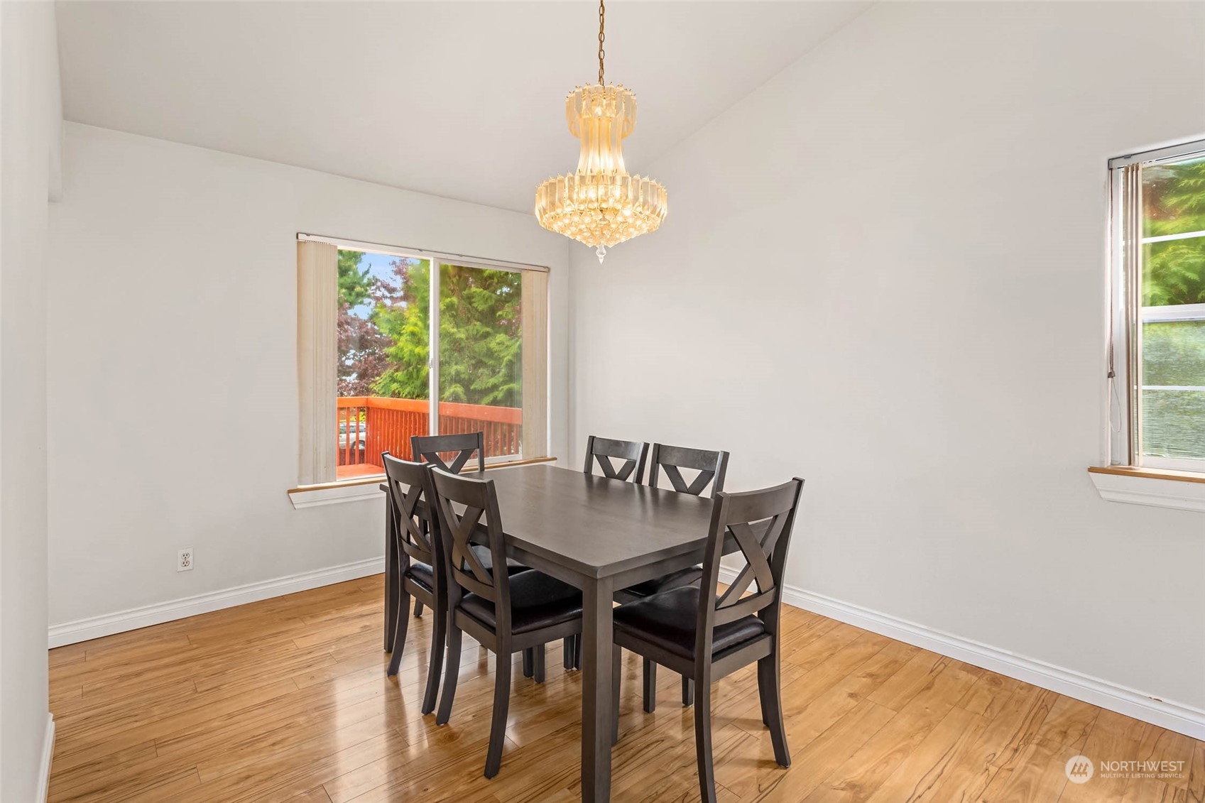 9031 West Mall Drive Everett, WA 98208 - Photo 9 of 32 a view of a dining room with furniture wooden floor and a chandelier