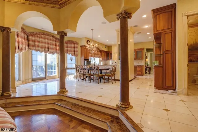 a room with gym equipment and large windows