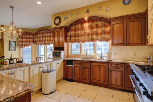 a kitchen with lots of counter space and windows