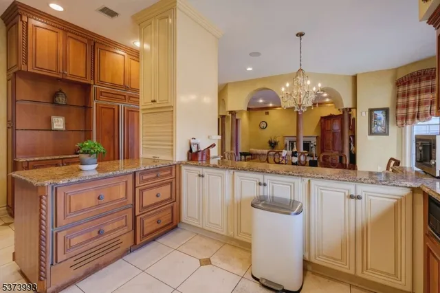 a kitchen with cabinets and window