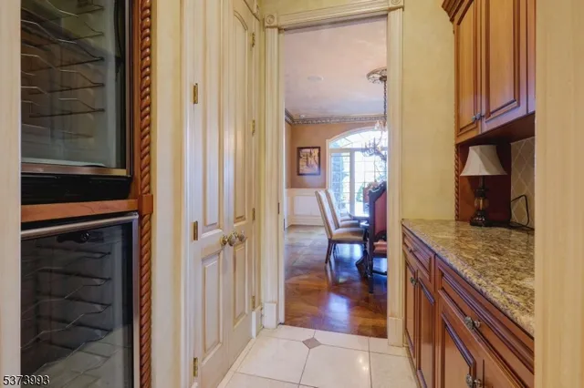 a hallway with dining table and chairs