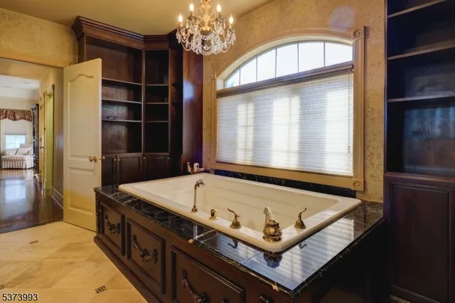 a bath room with a bed and a window
