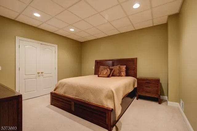 a bedroom with a bed and a night stand