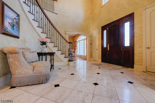 a view of hall way with furniture