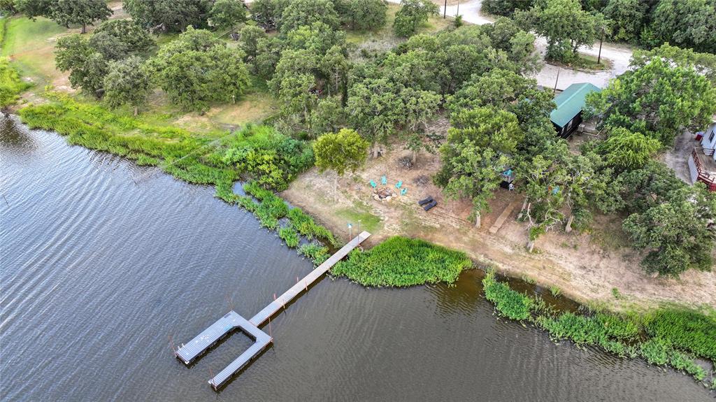 an aerial view of a wooden fence and trees