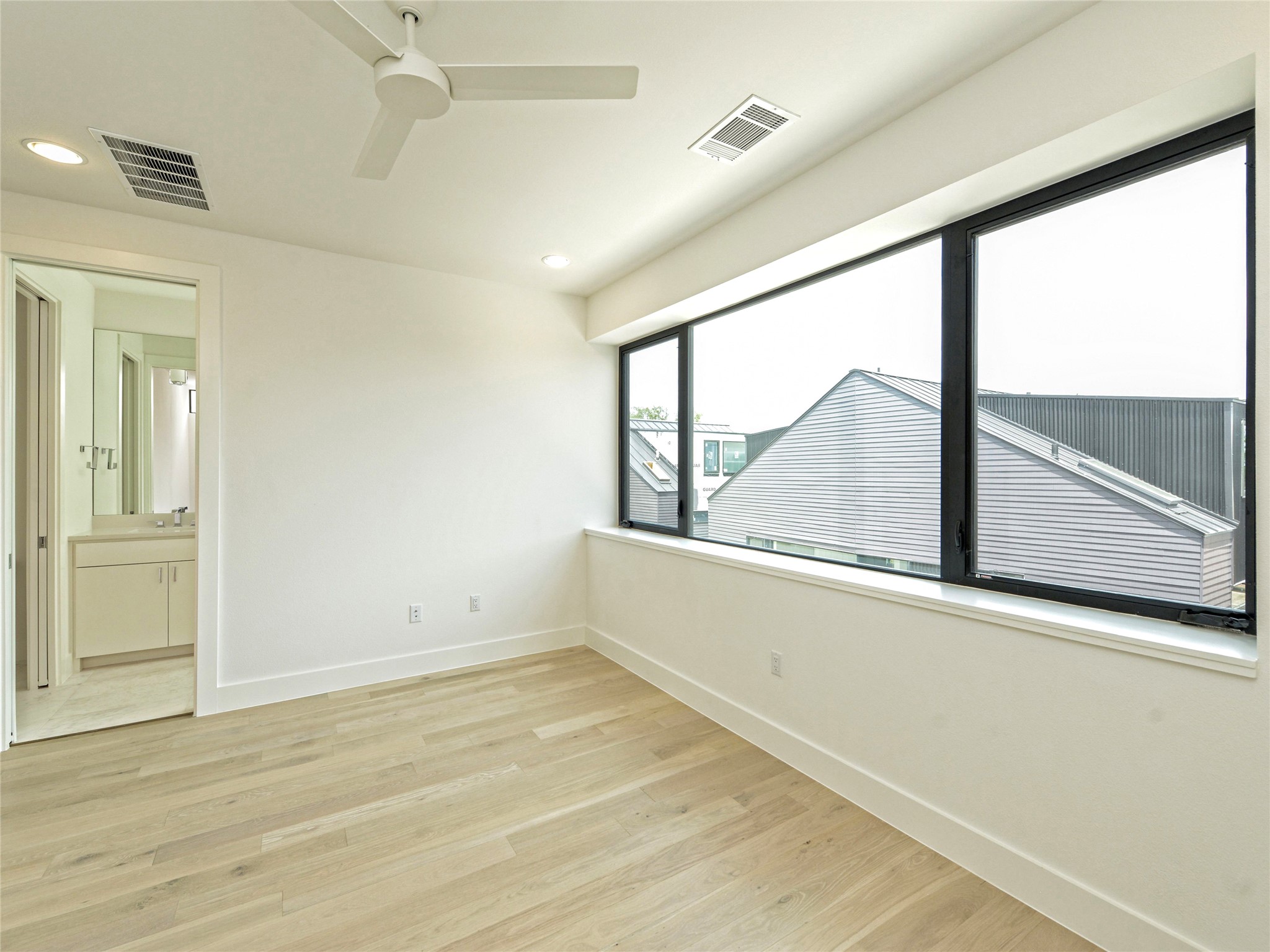 3406 East 17th Street, Unit 3 Austin, TX 78721 - Photo 17 of 27 a view of an empty room with a window