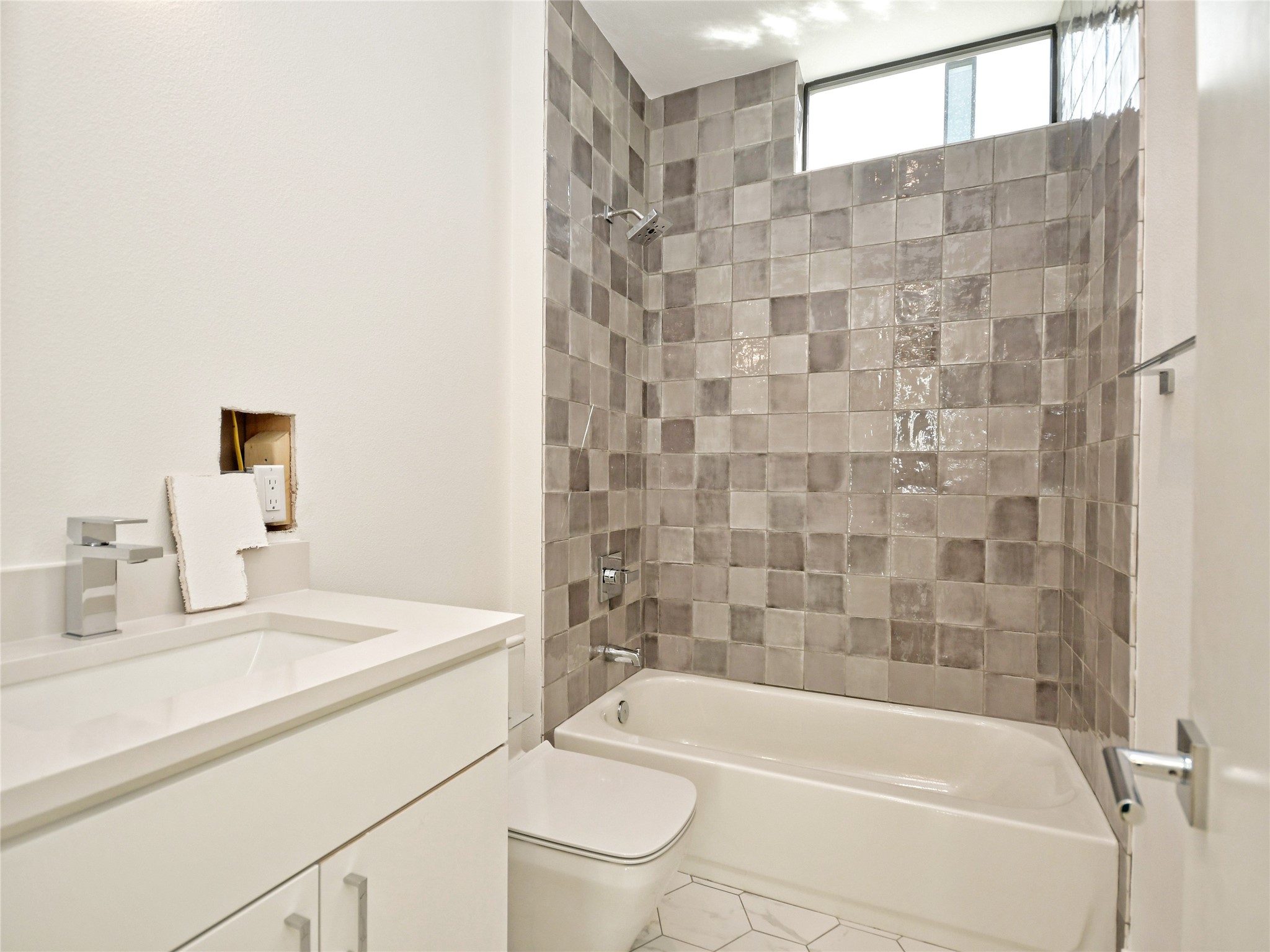 3406 East 17th Street, Unit 3 Austin, TX 78721 - Photo 21 of 27 a bathroom with a sink a toilet and shower