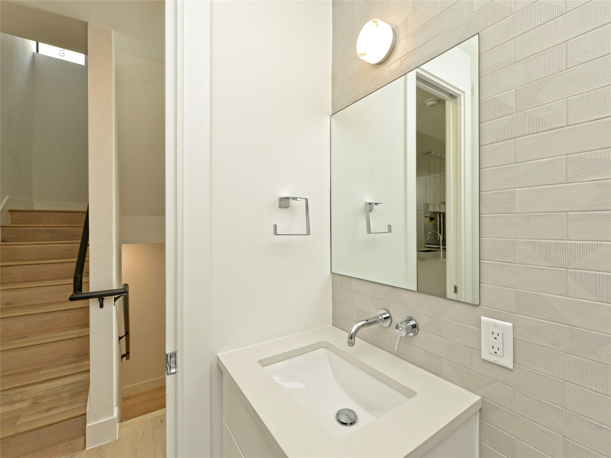 3406 East 17th Street, Unit 3 Austin, TX 78721 - Photo 22 of 27 a bathroom with a sink and a mirror