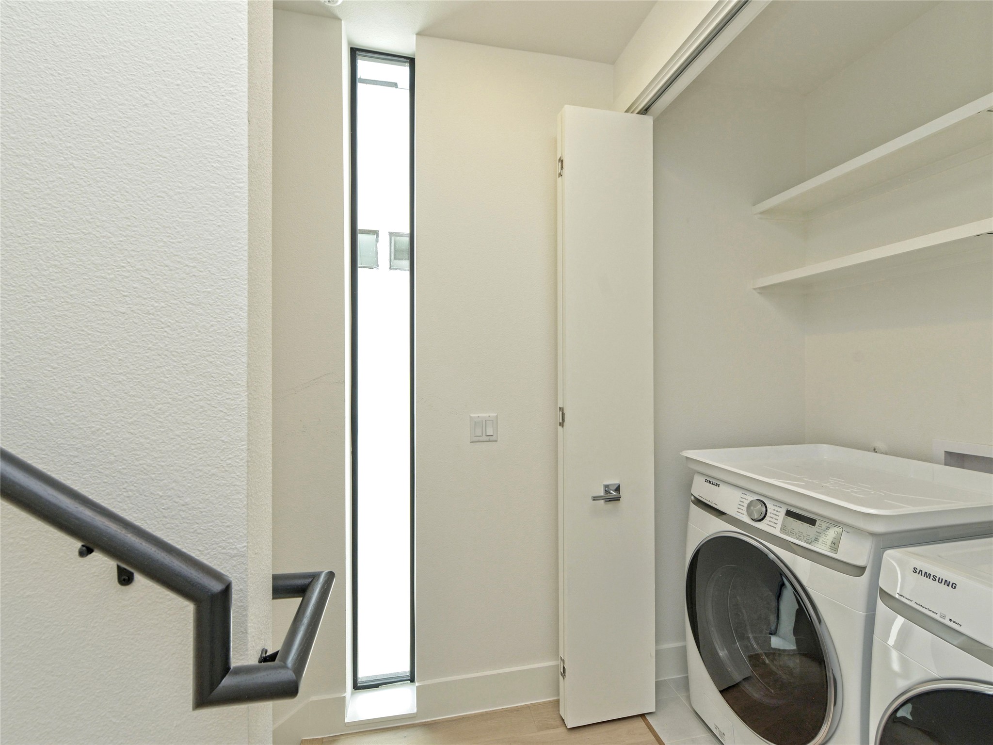 3406 East 17th Street, Unit 3 Austin, TX 78721 - Photo 24 of 27 a view of a hallway with washer and dryer