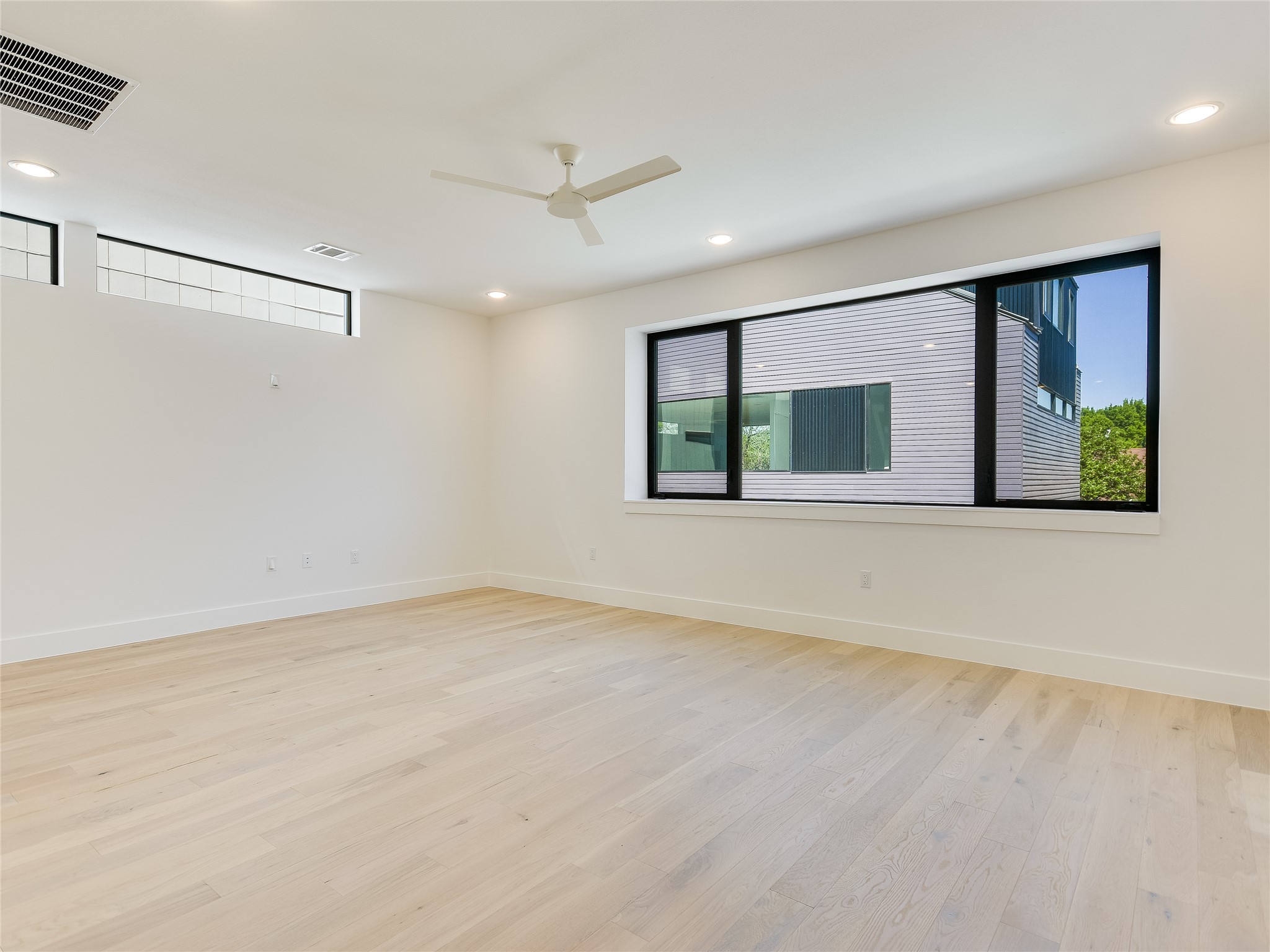 3406 East 17th Street, Unit 3 Austin, TX 78721 - Photo 26 of 27 a view of an empty room with a window and a kitchen