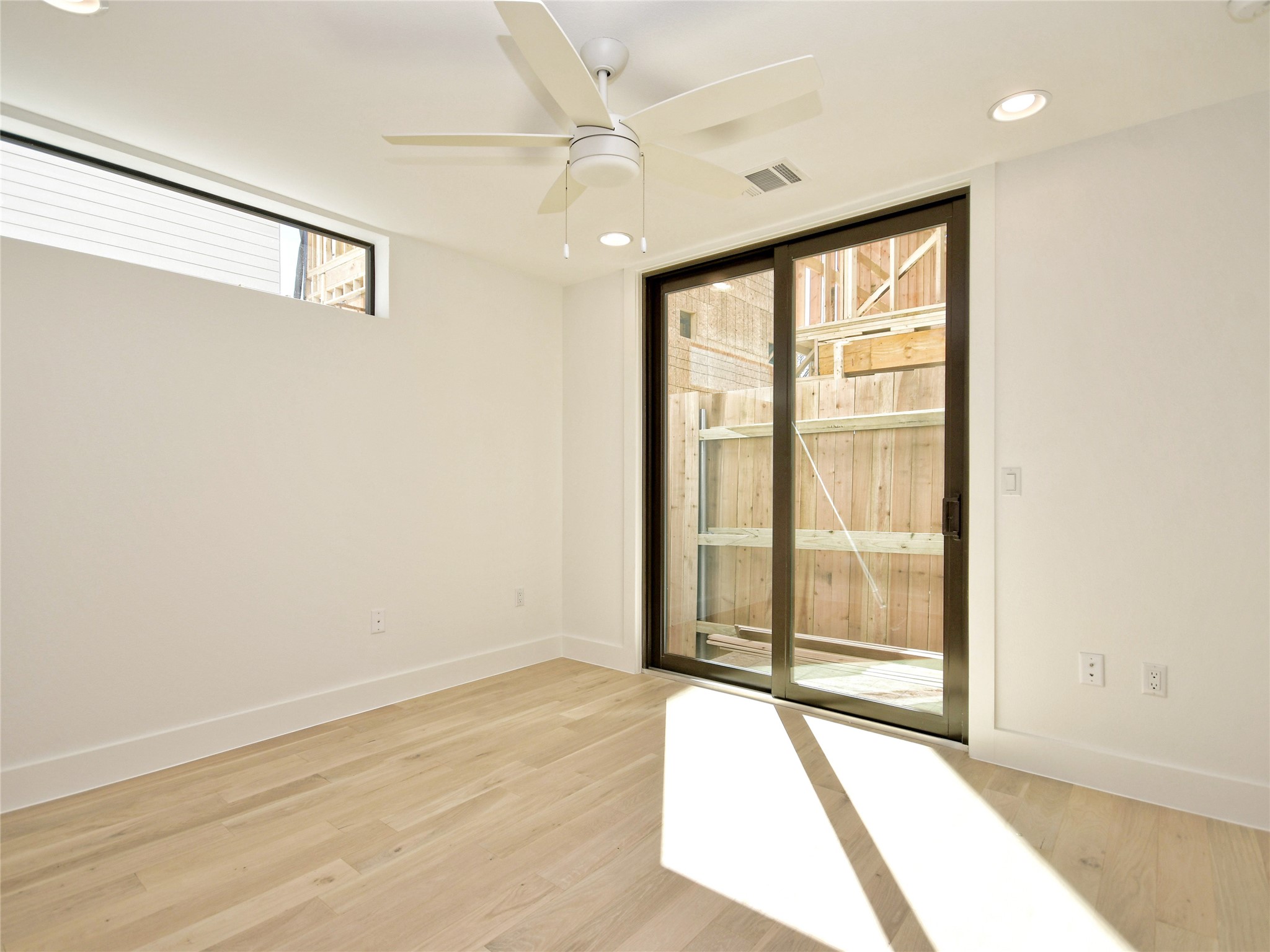 3406 East 17th Street, Unit 3 Austin, TX 78721 - Photo 6 of 27 a view of an empty room with a window