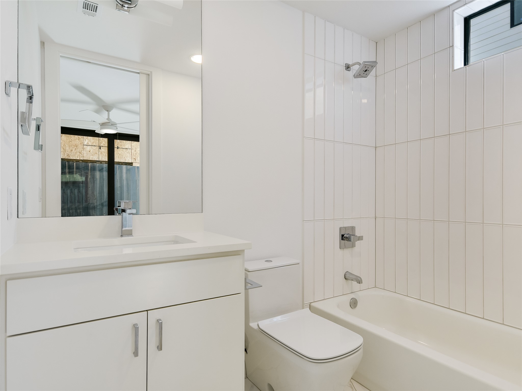 3406 East 17th Street, Unit 3 Austin, TX 78721 - Photo 8 of 27 a bathroom with a sink toilet vanity and shower