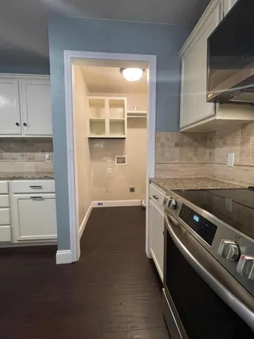 a kitchen with a stove and a microwave