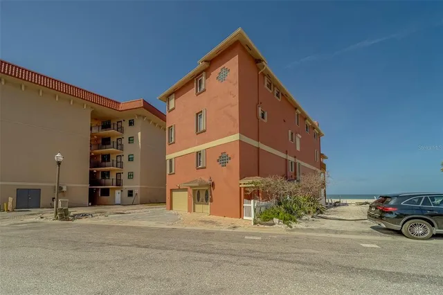 a bedroom with furniture a ceiling fan and a rug