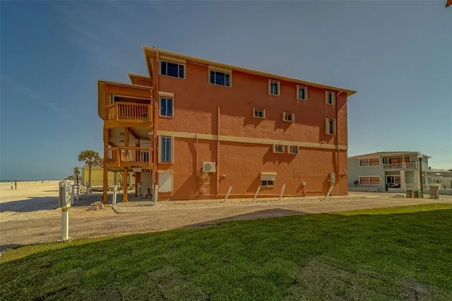 a bathroom with a granite countertop sink mirror vanity and toilet