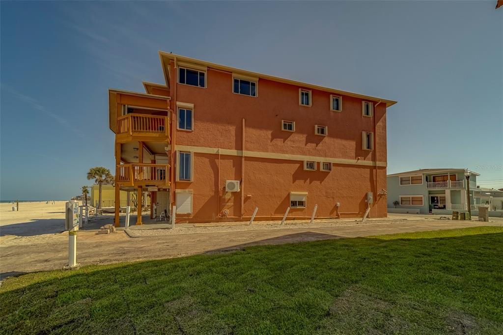 17606 Lee Avenue Redington Shores, FL 33708 - Photo 15 of 85 a front view of building with outdoor space