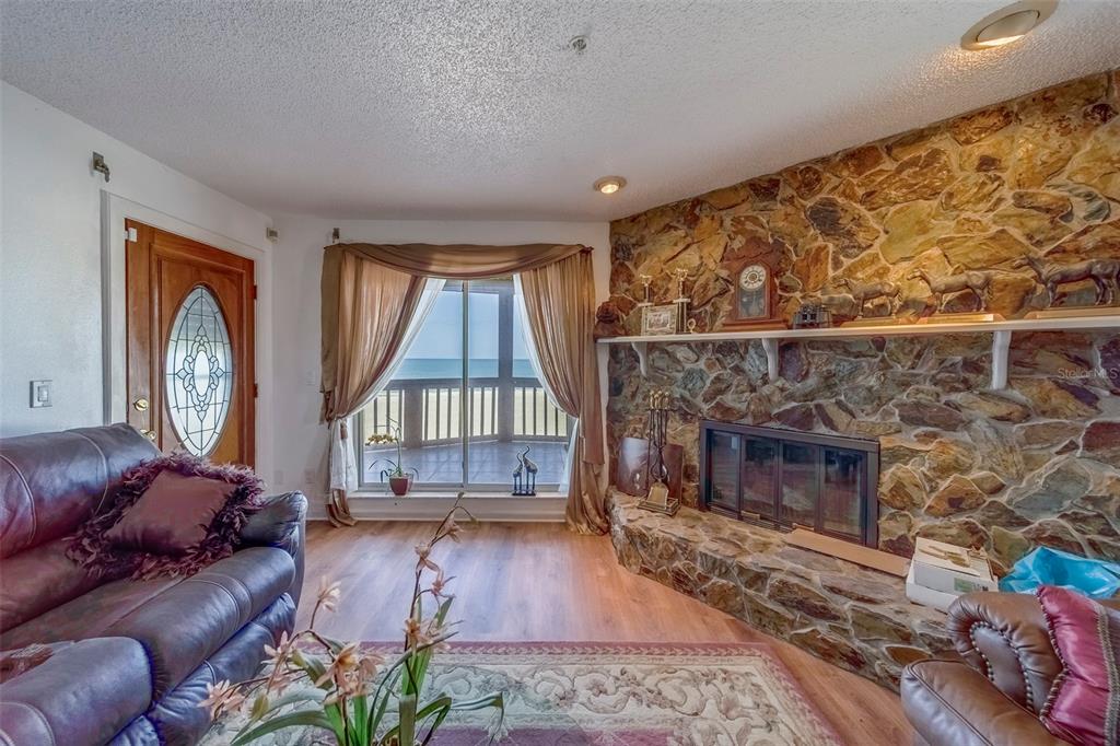 17606 Lee Avenue Redington Shores, FL 33708 - Photo 29 of 85 a living room with furniture a window and a fireplace