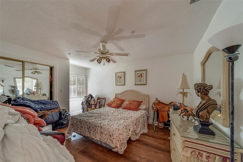 17606 Lee Avenue Redington Shores, FL 33708 - Photo 35 of 85 a bedroom with a bed and wooden floor