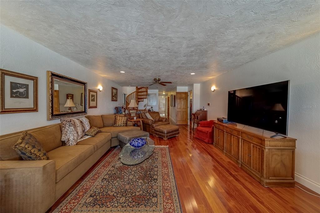 17606 Lee Avenue Redington Shores, FL 33708 - Photo 40 of 85 a living room with furniture and a flat screen tv