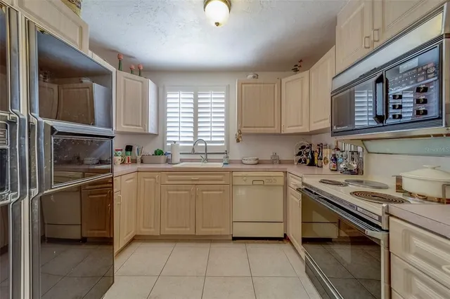 a bathroom with a sink a mirror and shower