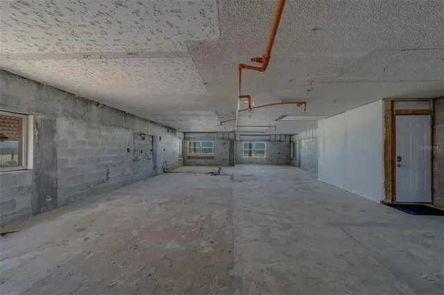 a living room with lots of furniture and wooden floor