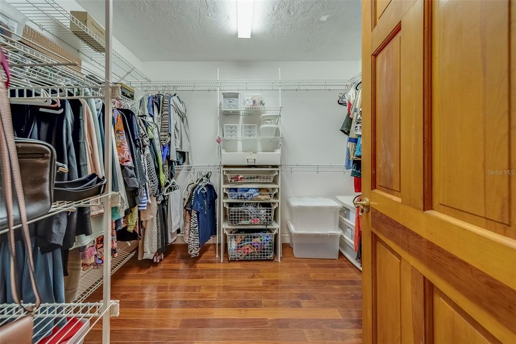 17606 Lee Avenue Redington Shores, FL 33708 - Photo 54 of 85 a view of walk in closet with clothes and shoes