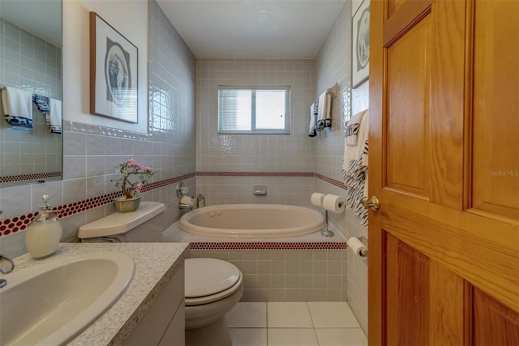 17606 Lee Avenue Redington Shores, FL 33708 - Photo 59 of 85 a bathroom with a sink and a toilet