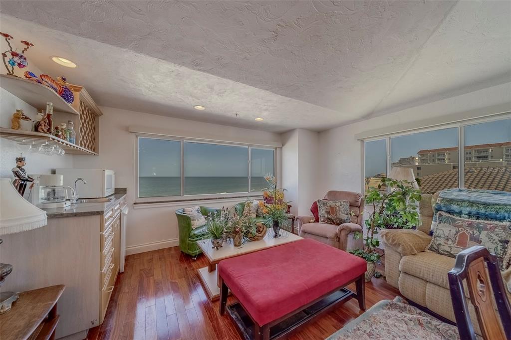 17606 Lee Avenue Redington Shores, FL 33708 - Photo 62 of 85 a living room with furniture and a flat screen tv