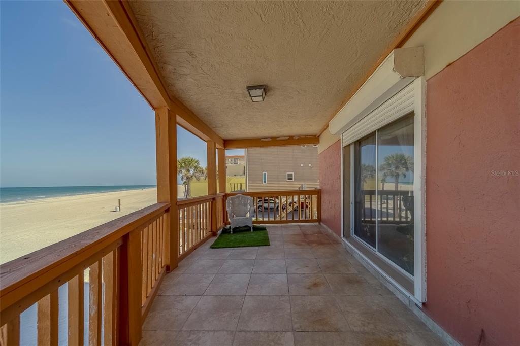 17606 Lee Avenue Redington Shores, FL 33708 - Photo 10 of 85 a view of a porch with wooden floor and furniture