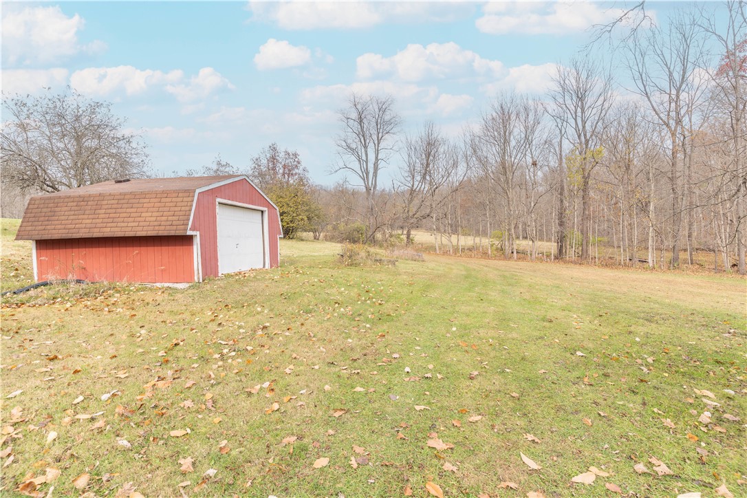 18333 Lefevre Number 2 Road Sidney, OH 45365 - Photo 19 of 25 This expansive yard offers ample space for outdoor activities and a versatile outbuilding.