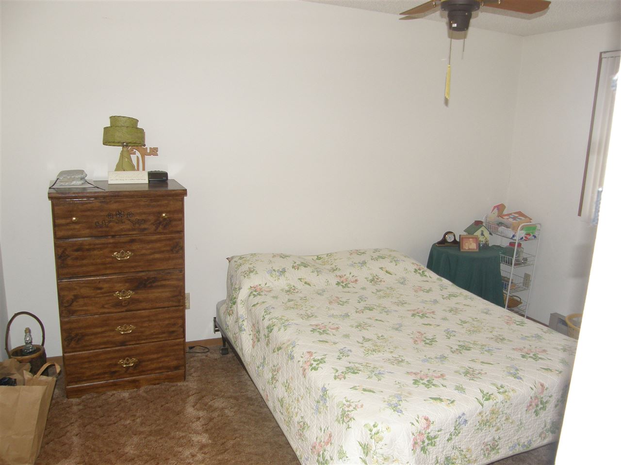 505 Lake Summerset Road Lake Summerset, IL 61019 - Photo 12 of 16 a bedroom with a bed and a dresser