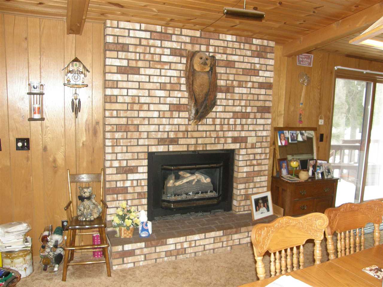 505 Lake Summerset Road Lake Summerset, IL 61019 - Photo 7 of 16 a living room with furniture windows and a fireplace