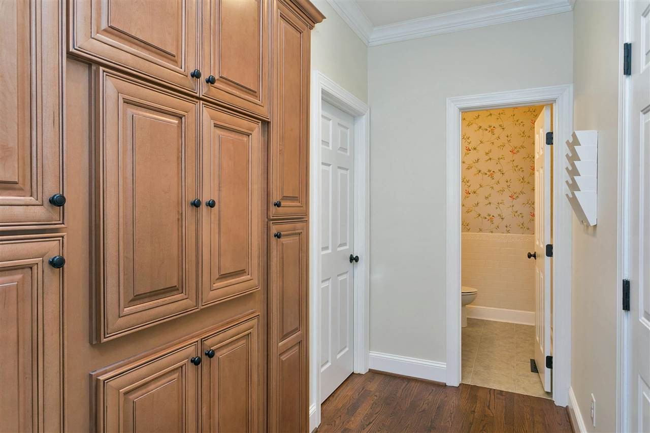 7102 Spring Ridge Road Cary, NC 27518 - Photo 12 of 25 THIS IS SO UNIQUE YOU WILL LOVE IT...LAUNDRY TUCKED IN THIS CUSTOM CABINET! JUST OFF THE GARAGE AND RIGHT BY A HUGE PANTRY SO BECOMES A NATURAL "DROP" AREA. LAUNDRY
