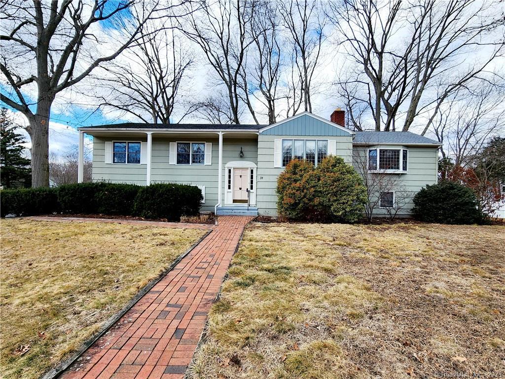 31 Dell Circle Trumbull, CT 06611 - Photo 1 of 1 a front view of a house with a yard