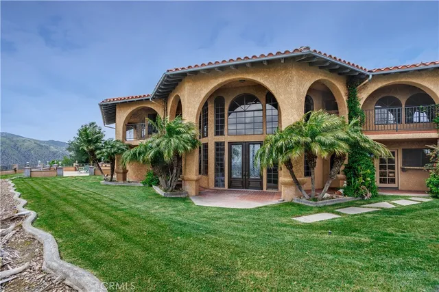 an outdoor space with furniture and garden