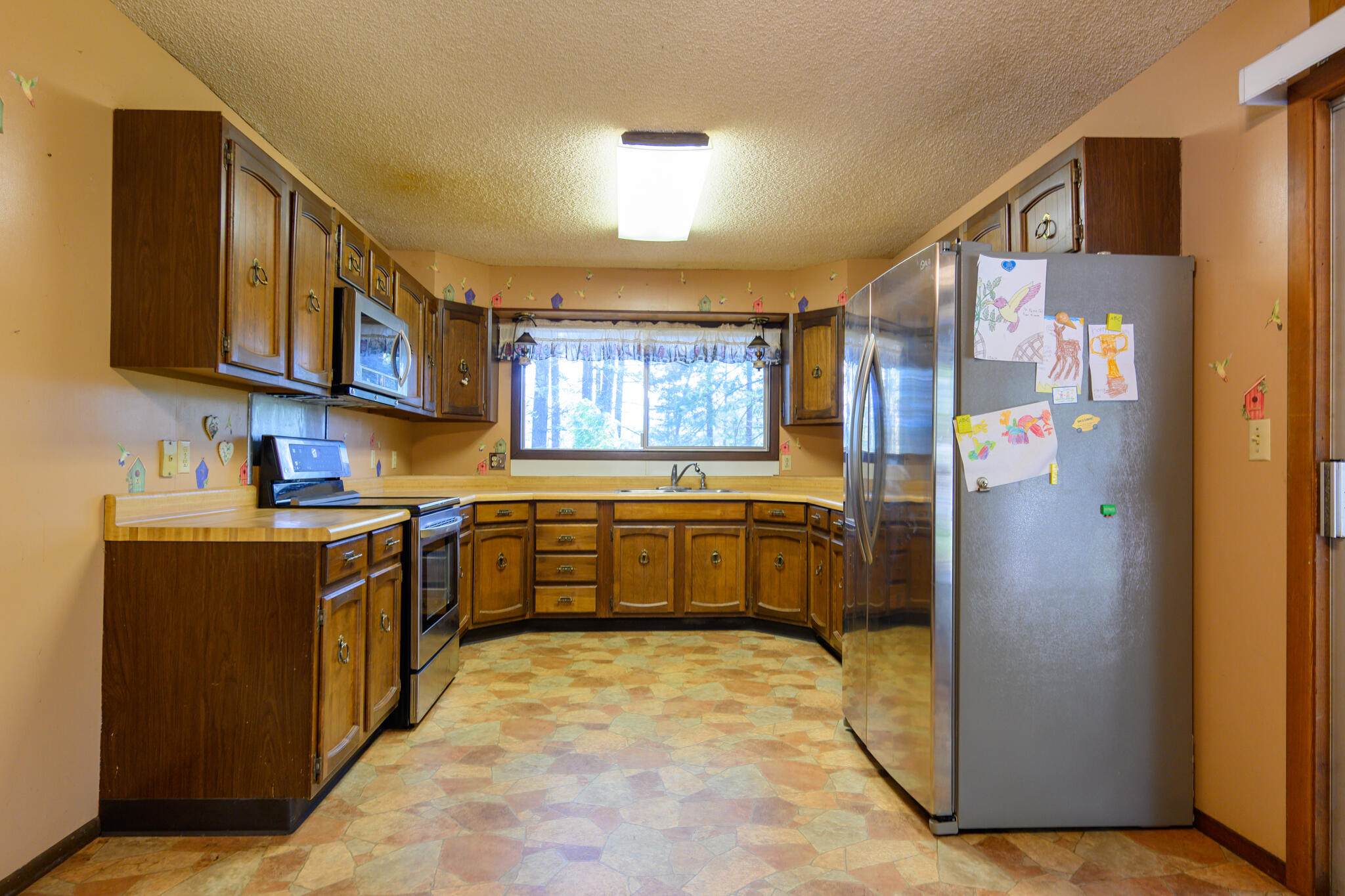81 Swift Creek Road Trinity Center, CA 96091 - Photo 24 of 54 a kitchen with a refrigerator and a sink