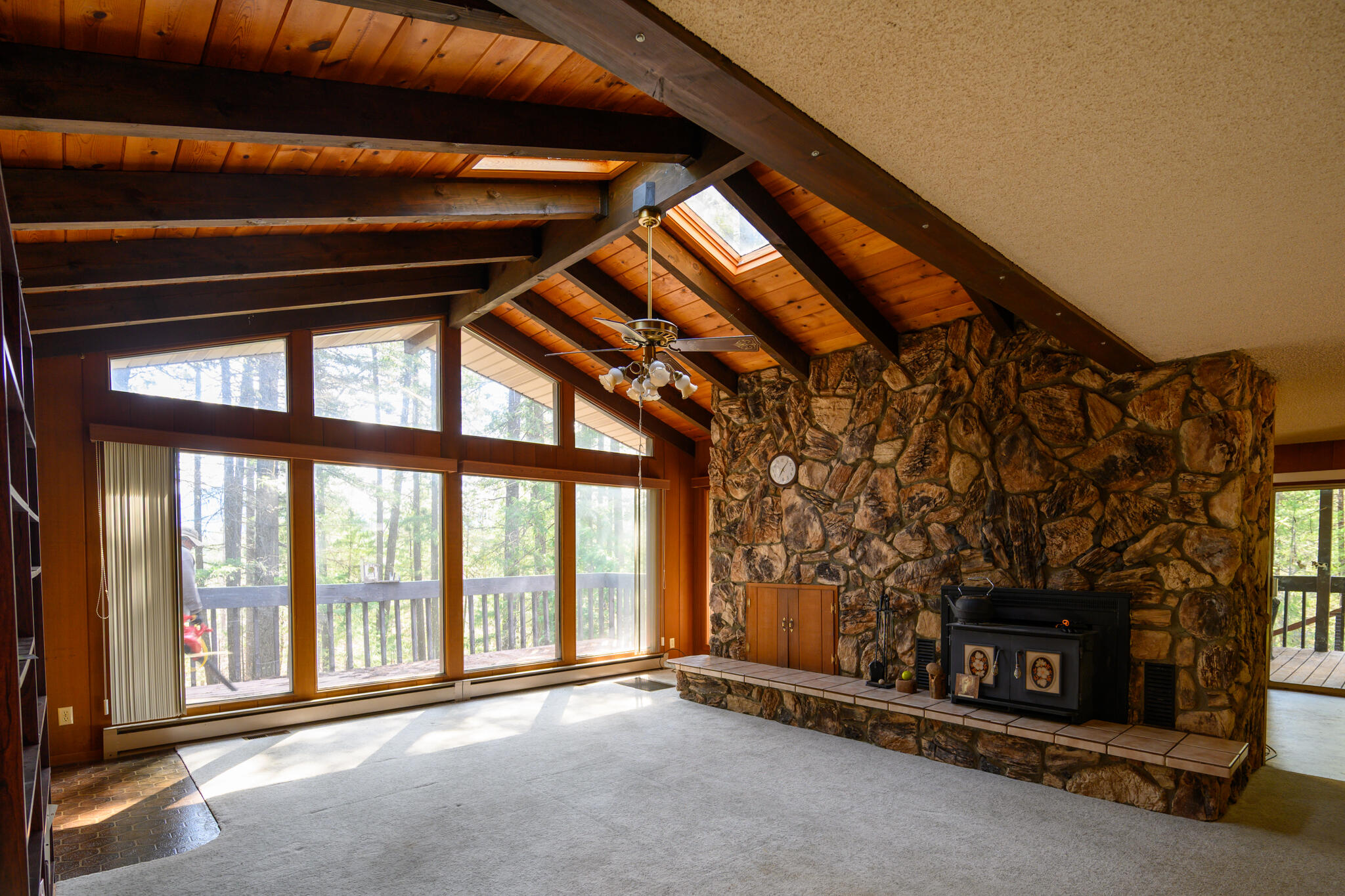 81 Swift Creek Road Trinity Center, CA 96091 - Photo 4 of 54 a view of an empty room with a fireplace and window