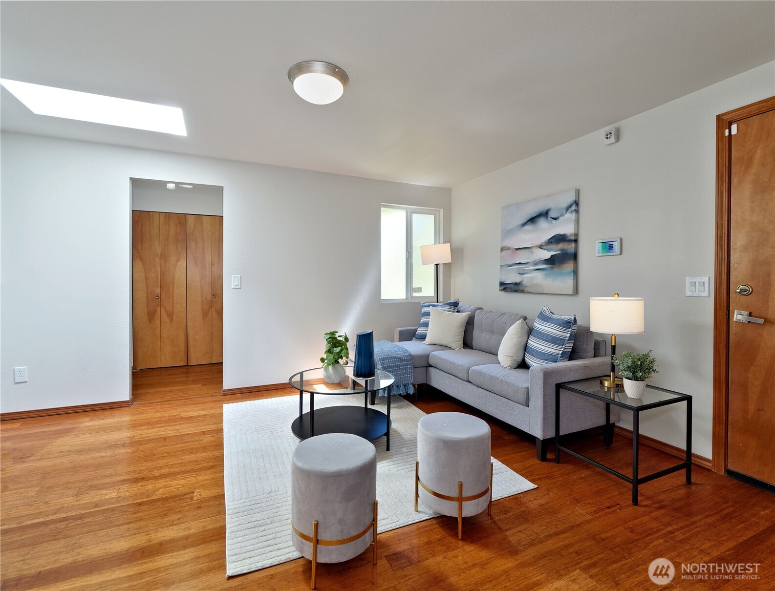 10925 Southeast 183rd Place Renton, WA 98055 - Photo 13 of 34 a living room with furniture and a wooden floor