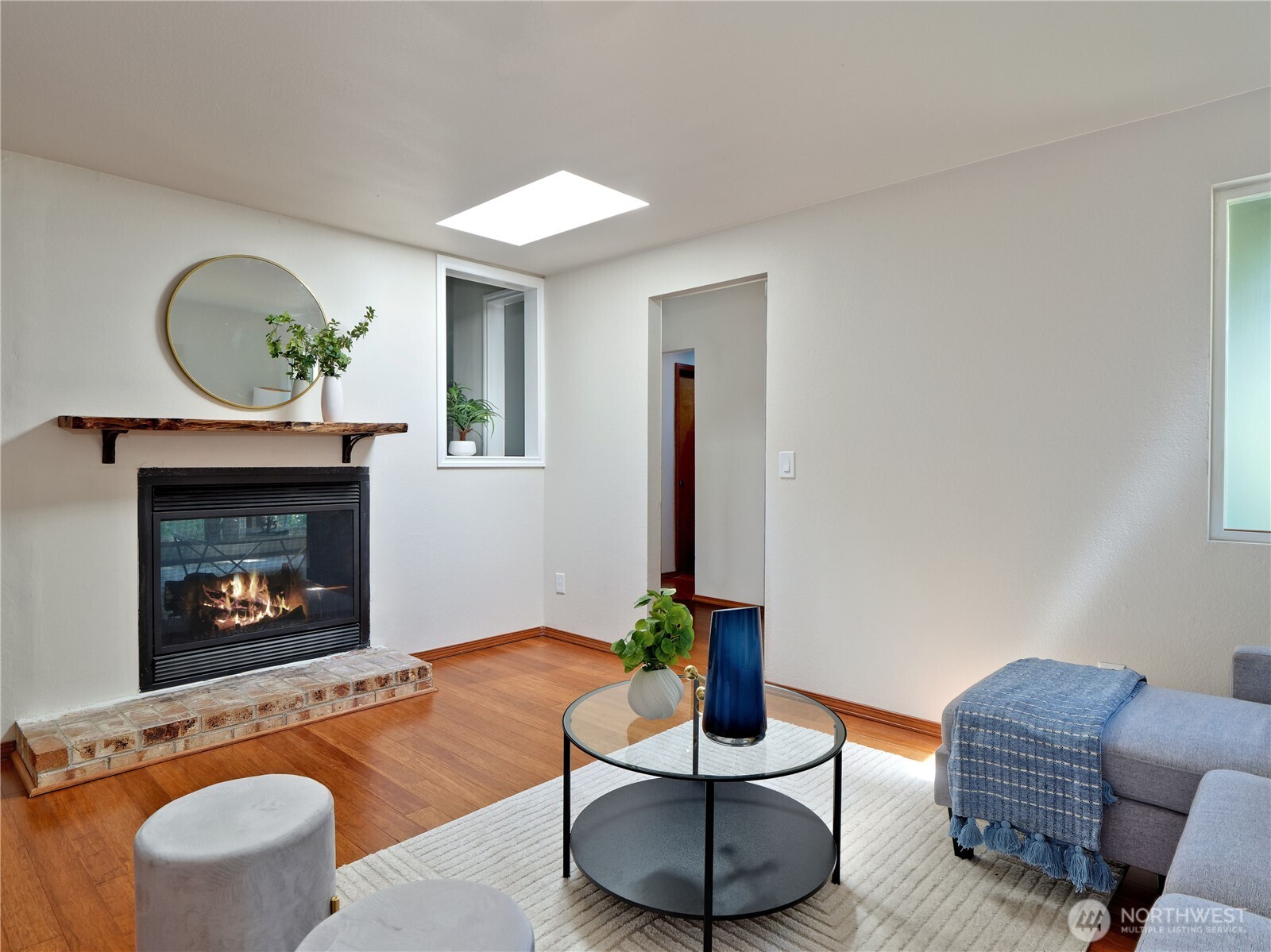 10925 Southeast 183rd Place Renton, WA 98055 - Photo 14 of 34 a living room with furniture a fireplace and a potted plant