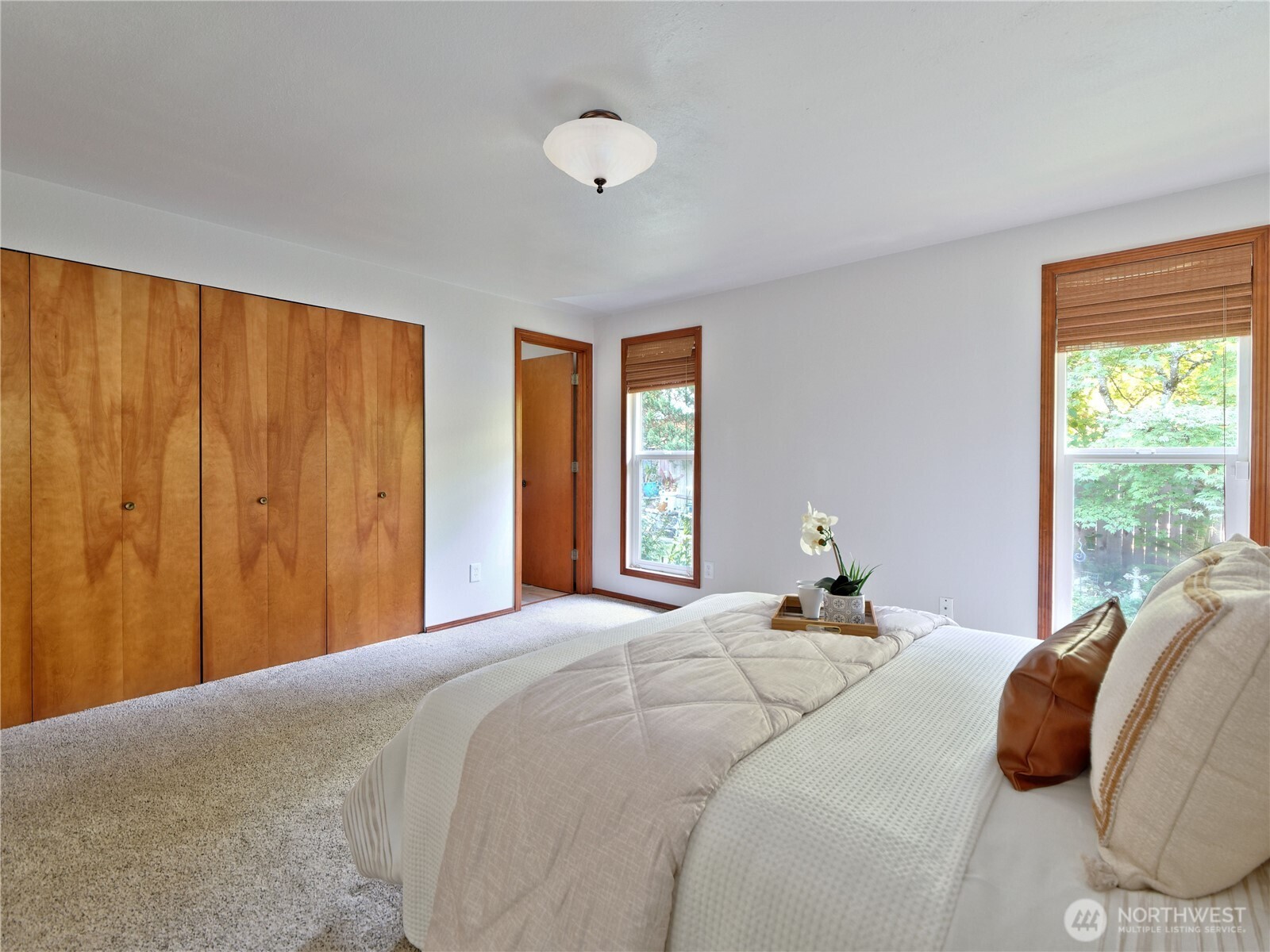 10925 Southeast 183rd Place Renton, WA 98055 - Photo 20 of 34 a bedroom with a bed and a window