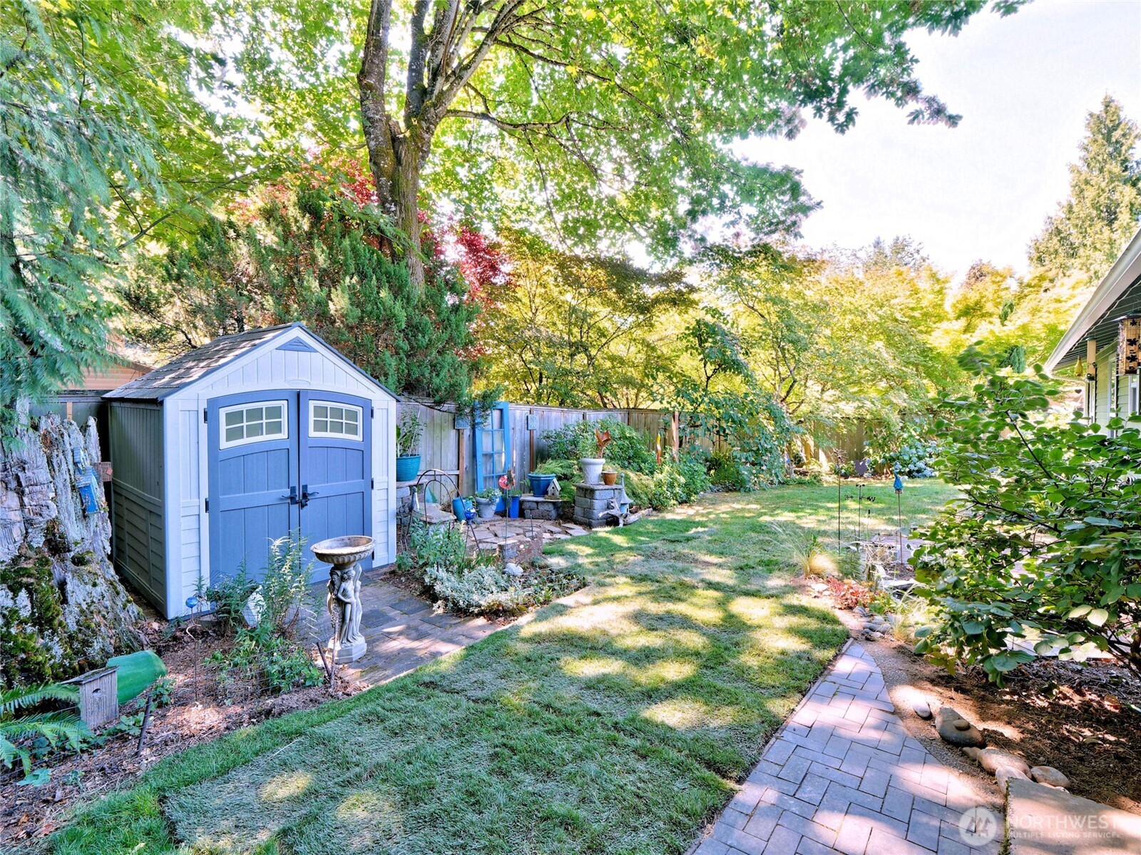 10925 Southeast 183rd Place Renton, WA 98055 - Photo 26 of 34 a backyard of a house with table and chairs