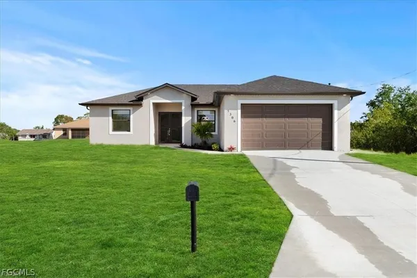 a front view of a house with a yard
